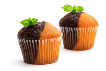 Fresh baked pumpkin and chocolate minimuffins isolated on white