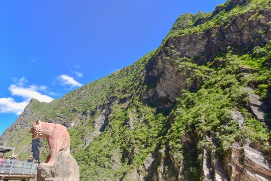 Tiger Statue and Green Mountains at Tiger Leaping Gorge