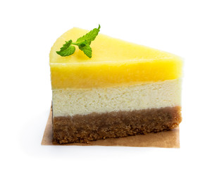 Slice of homemade lemon cheesecake isolated on white