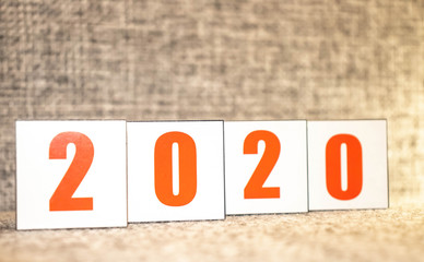 2020 text on wooden cubes on desk