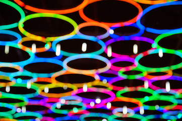 Christmas lights over the path, colorful circles, blurred background