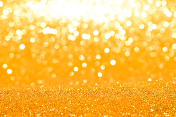 shine and sparkle of golden glitter abstract background	