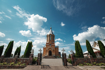 Obraz premium Wedding accessories and interior in Saint Trinity Orthodox Convent including two candlesticks with many candles, flowers, icons and Holy Bible. Wonderful church in Riga, Latvia