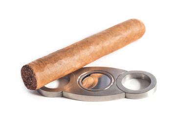 Cuban cigar, and cigar scissors close-up, on a white background.