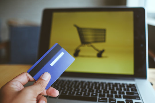 Comfort e-commerce shopping. Royalty high quality free stock photo image of shopping online and payment by credit card. Using laptop and mobile phone to online shopping and pay by visa credit card