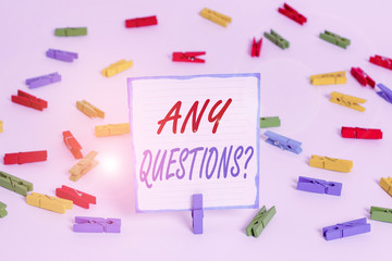 Handwriting text Any Questions Question. Conceptual photo you say write order to ask demonstrating about something Colored clothespin papers empty reminder white floor background office