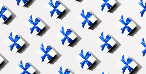 Collection of gift boxes with blue ribbons - flat lay