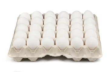 30 farm fresh white eggs in a tray isolated on white