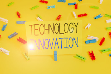 Text sign showing Technology Innovation. Business photo text significant technological changes of products Colored clothespin papers empty reminder yellow floor background office