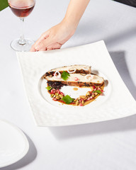 Beautiful and tasty food on a plate, exquisite dish, creative restaurant meal concept.