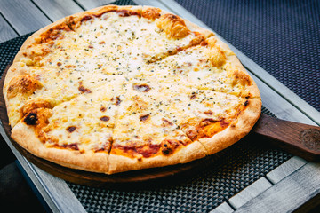 Italian pizza Margarita on wood table with ingredients