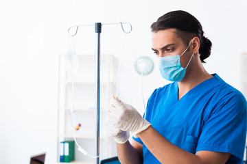 Young male doctor working in the clinic