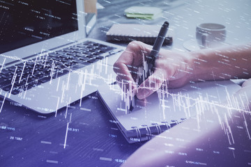 Forex chart displayed on woman's hand taking notes background. Concept of research. Multi exposure