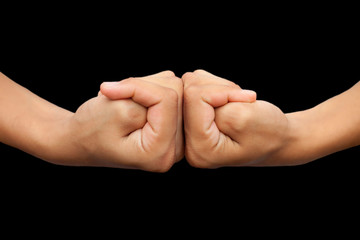 Isolated pair of hands of a male teenager on black background doing Brahma yoga mudra.Horizontal...