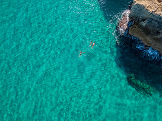 Aerial view of the Riaci rocks, Riaci beach near Tropea, Calabria. Italy. Beaches and crystal clear sea. Bathers who swim and snorkel