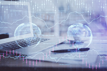 Forex graph hologram on table with computer background. Double exposure. Concept of financial markets.