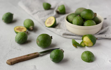 Feijoa fruits on grey background, or pineapple guava healthy tropical fruit