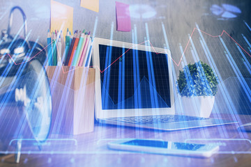 Multi exposure of graph and financial info and work space with computer background. Concept of...