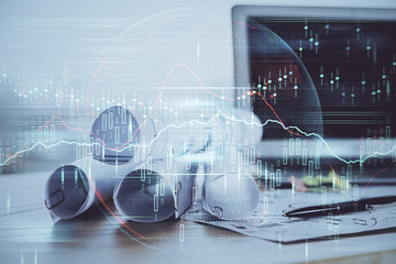 Financial chart drawing and table with computer on background. Double exposure. Concept of international markets.