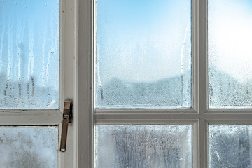 Cold room interior looking out onto water condensation formed on interior windows during early...