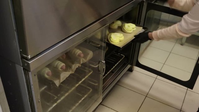 cook in the culinary shop makes dough rolls pies and pretzels
