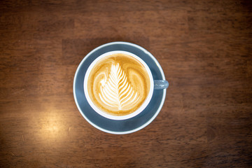cup of coffee on wooden table