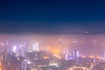 Wide-angle night aerial view of Wuhan financial district, Hubei, China.Financial concept