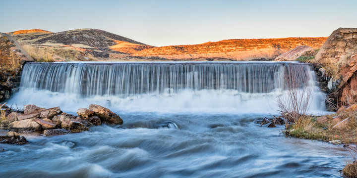 Water Cascading Over A Diversion Dam