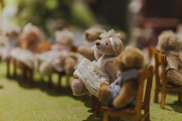 Brown bear doll in the garden.