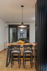 Kitchen and dining area in open plan apartment interior