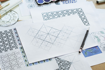 Designer designing drawing sketch pattern geometric flower seamless wallpaper fabric textile...