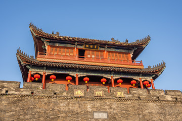Traditional facade of buildings, exterior of buildings,loated Jingzhou China.Close-up of historic buildings.There china letters on building is"Jingzhou gate" builded in the Three Kingdoms Period.