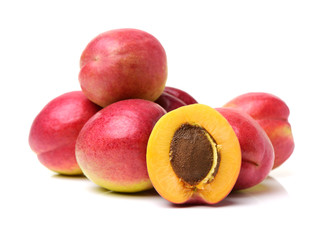 ripe apricot with leaves isolated on white background