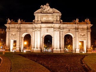  monument of the alcala de madrid gate illuminated at night