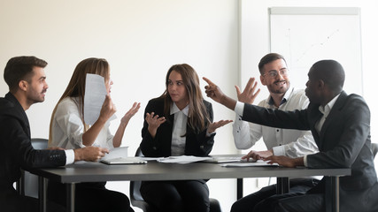 Mad diverse employees dispute at office meeting