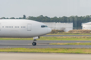 The plane that is waiting to pick up passengers at the airport