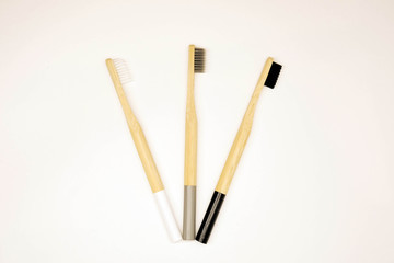 Black and white bamboo toothbrush on white background. Tooth care hygiene. 