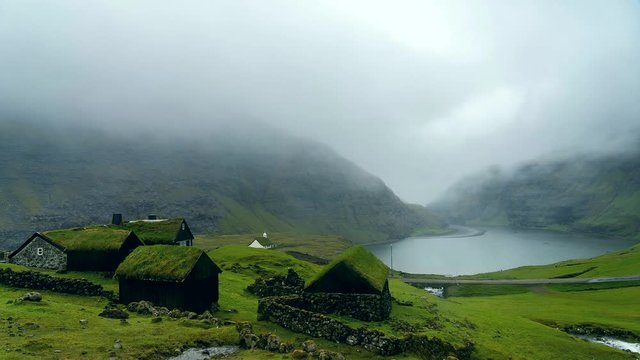 Popular village Saksun with little white church located on the island of Streymoy, Faroe Islands.