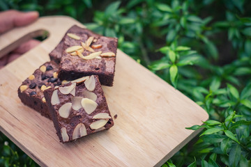 Fudge brownies on wooden plate and top view