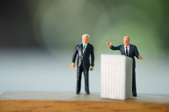 Miniature Politician Speaking To The People During An Election Rally