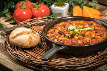 Chili con carne in a clay pan.