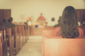 Back view of Girl in Church.Church Congregation Service and Christian worship.church interior...