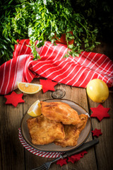 Fried cod slices in breadcrumbs.