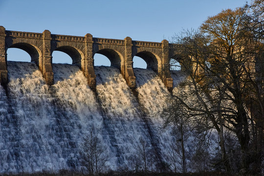 Water fowing over reservoir