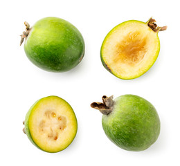 Set of green feijoa and two halves on a white. The view of the top.