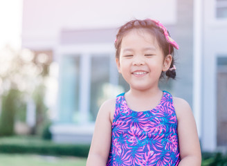 Blind little girl smile.Little girl close eyes.Blind person.