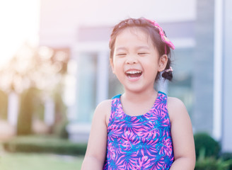 Blind little girl smile.Little girl close eyes.Blind person.