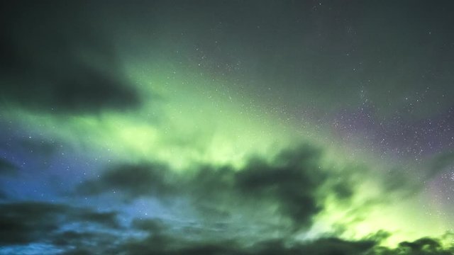 Northern lights on a partly cloudy night in Yukon 4K timelapse