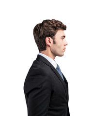 Side view of handsome young businessman, isolated