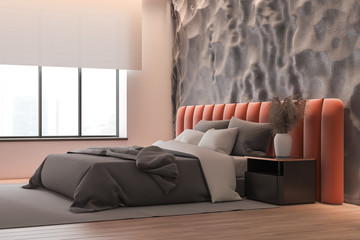 Gray and pink bedroom corner with orange bed